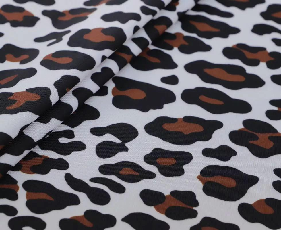 IMG_0989 Leopard printed poly spandex in white, black, and brown — wholesale fabric