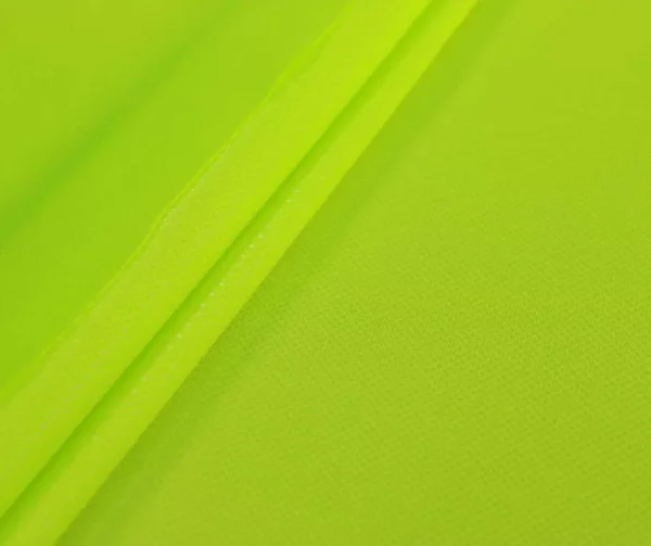 Clear dot metallic spandex in chartreuse — wholesale stretch fabric