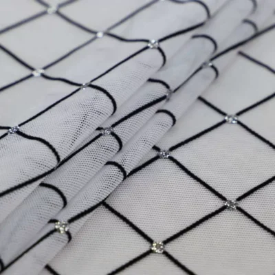Diamonds mesh spandex flock glitter in white, black, and silver — wholesale fabric