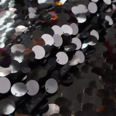 Black teardrop paillette sequins on black mesh — wholesale stretch fabric