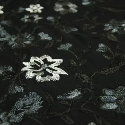 Black charcoal grey floral embroidery on black power mesh — wholesale fabric