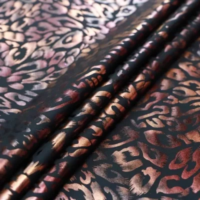 Ferocious foil spandex in black, burgundy, and tan — wholesale fabric