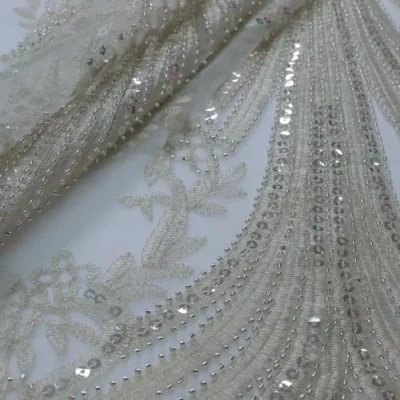 Stunning alabaster beaded lace sequins on tulle — wholesale fabric