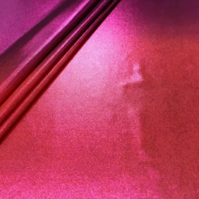 Ombre pin dot spandex in magenta, orange, and fuchsia — wholesale fabric