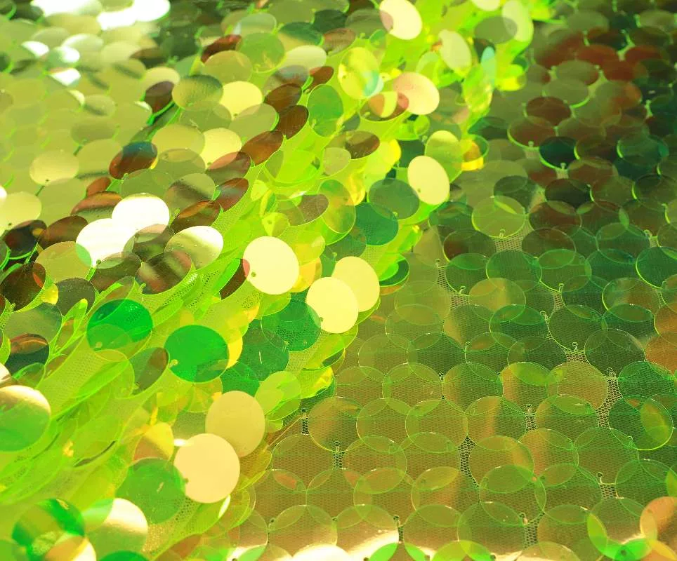 IMG_8121 Lime green iridescent teardrop paillette sequins on lime mesh — wholesale fabric