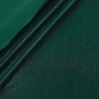 Pin dot metallic spandex in forest green and black — wholesale fabric