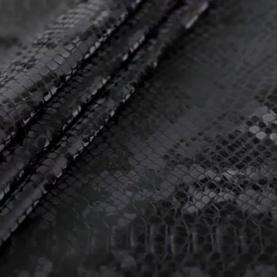 Reptile pattern printed vinyl 3D viper spandex in black — wholesale fabric
