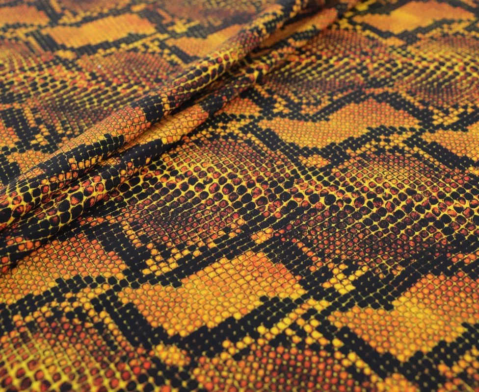 IMG_0652 Snakeskin background printed spandex in black and gold — wholesale fabric