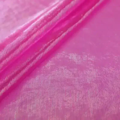 Sheer iridescent fabric in opalite fuchsia — wholesale stretch fabric