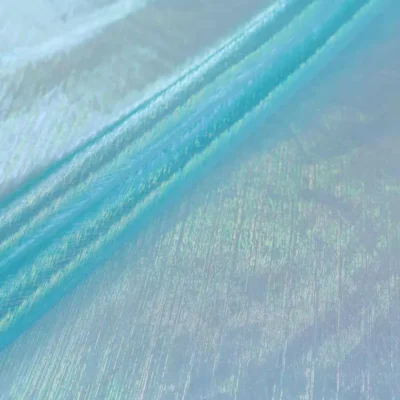 Sheer iridescent fabric in opalite blue — wholesale stretch fabric