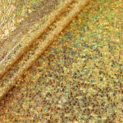 Shattered glass oil slick foil spandex in gold — wholesale stretch fabric