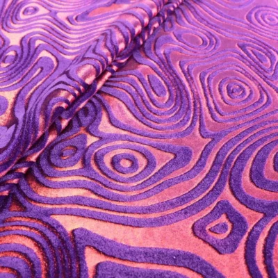 Intricate folds velvet stretch foil in red and purple — wholesale fabric