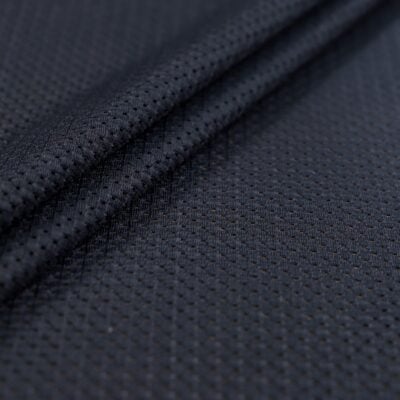 Close-up of dark navy blue athletic mesh fabric texture